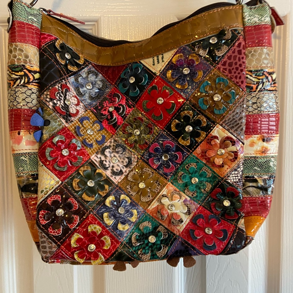 Treska multi color flowered leather shoulder bag.